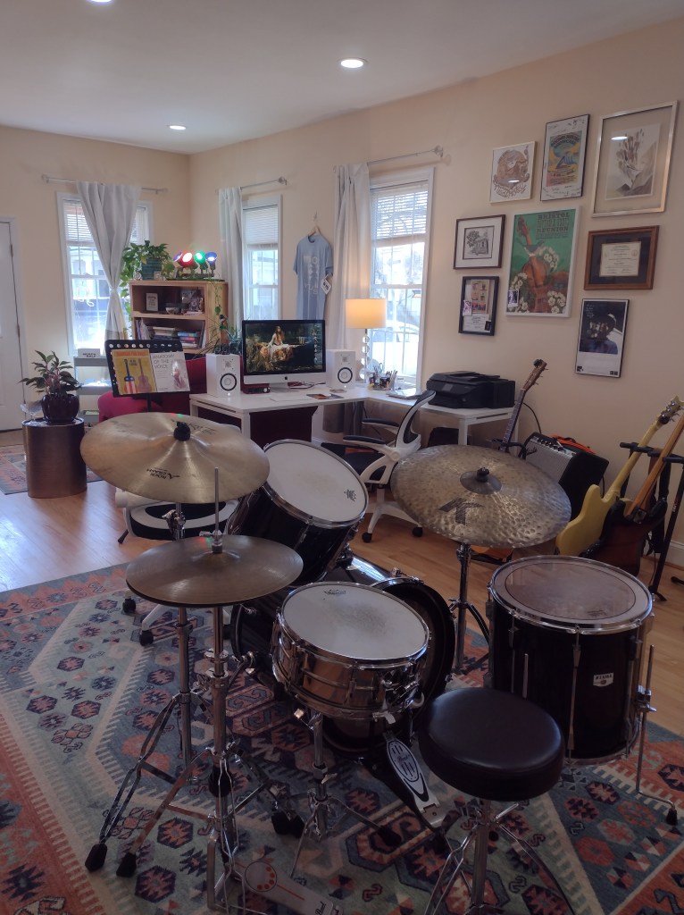 viewing the desk from behind the drums